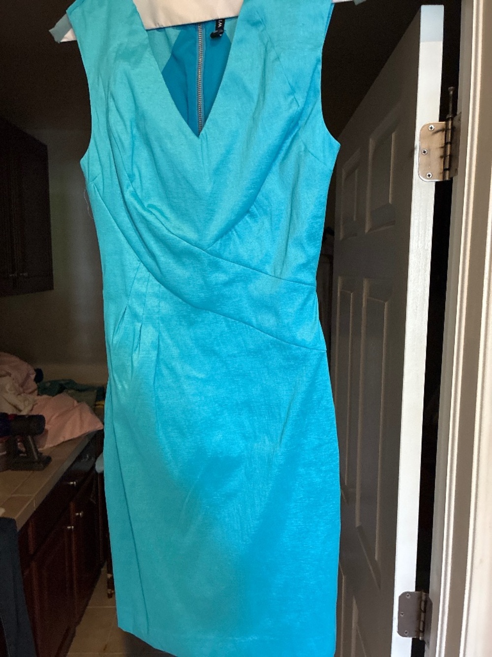Woman’s turquoise dress